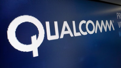 This Wednesday, Feb. 14, 2018 file photo shows the logo for Qualcomm on a screen at the Nasdaq MarketSite, in New York. A federal appeals court is temporarily protecting Qualcomm from an antitrust ruling that would have forced the mobile chipmaker to drastically change how it licenses key technology for connecting smartphones to the internet. Friday, Aug. 23, 2019 stay granted by the 9th U.S. Circuit Court of Appeals will prevent the Federal Trade Commission from enforcing key provisions of a lower court ruling that said Qualcomm abused its patents to stifle competition.