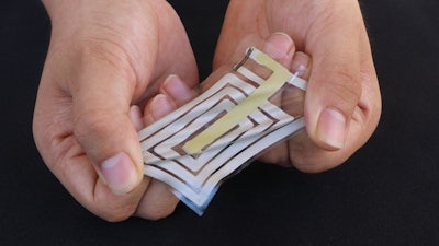 Using metallic ink, researchers screen-print an antenna and sensor onto a stretchable sticker designed to adhere to skin and track pulse and other health indicators, and beam these readings to a receiver on a person's clothing.