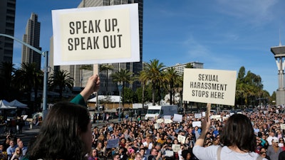 In this Nov. 1, 2018, file photo, Google employees hold up signs during a walkout rally at Harry Bridges Plaza in San Francisco to protest against what they said is the tech company's mishandling of sexual misconduct allegations against executives. Employees at Google, Amazon, Microsoft and elsewhere are increasingly speaking out about military warfare, immigration and the environment, and questioning the effects of their work. Experts say it’s an unprecedented trend of activism in Big Tech.