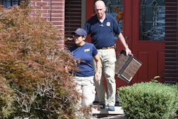 FBI investigators leave the home of UAW President Gary Jones during a search on Wednesday, August 28, 2019 in Canton, Michigan.