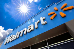 This June 25, 2019, file photo shows the entrance to a Walmart in Pittsburgh. A lawsuit filed earlier this week by Walmart over fires in rooftop solar panels made by Tesla Inc. has been sealed by the court, and both sides say they look forward to addressing all issues. In joint statements Friday, Aug. 23, the companies say they look forward to re-activating the panels once both sides are certain that all concerns have been addressed.