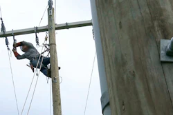 In this Thursday, March 21, 2019, photo, 120 feet off the ground, Jordan Demartino hangs from a training pole near Duke Energy's field office in Simpsonville, S.C.