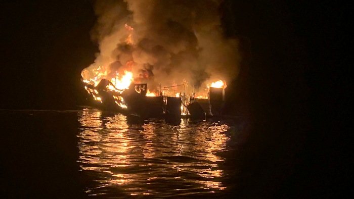 In this Sept. 2, 2019, file photo, a dive boat is engulfed in flames off the Southern California Coast.