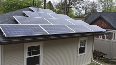 A garage with rooftop solar panels to generate electricity for a nearby house is seen in Billings, Mont. on Thursday, May 23, 2019.