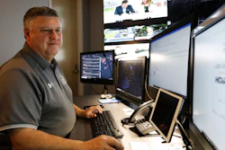 In this July 30, 2019, photo, Paul Hildreth works in the emergency operations center at the Fulton County School District Administration Center in Atlanta.