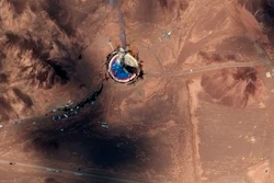 This satellite image from Maxar Technologies shows a fire at a rocket launch pad at the Imam Khomeini Space Center in Iran's Semnan province, Thursday, Aug. 29, 2019.