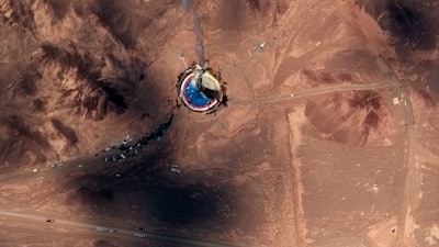 This satellite image from Maxar Technologies shows a fire at a rocket launch pad at the Imam Khomeini Space Center in Iran's Semnan province, Thursday, Aug. 29, 2019.