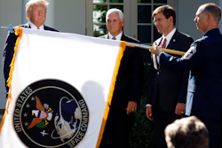 The flag for U.S. Space Command is unfurled during a Rose Garden ceremony, Thursday, Aug. 29, 2019.