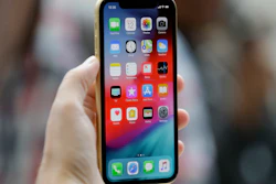 This Sept. 12, 2018, file photo shows an Apple iPhone XR on display at the Steve Jobs Theater in Cupertino, Calif.
