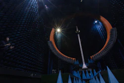 In this Aug. 21, 2019, photo, an engineer describes the function of the Spherical Near Field Test System at the Huawei lab in Dongguan, China.