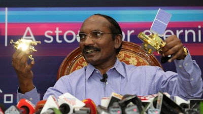 In this Aug. 20, 2019, file photo, Indian Space Research Organization Chairman Kailasavadivoo Sivan displays a model of Chandrayaan 2 orbiter and rover during a press conference at their headquarters in Bangalore.