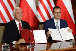 Vice President Mike Pence and Polish Prime Minister Mateusz Morawiecki display an agreement they signed in Warsaw, Sept. 2, 2019.