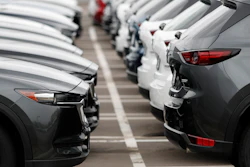 In this Sunday, May 19, 2019, file photo, lines of unsold vehicles sit at a dealership in Littleton, Colo.