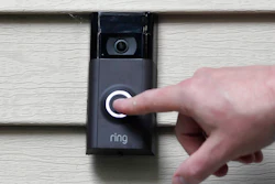 In this Tuesday, July 16, 2019, file photo, Ernie Field pushes the doorbell on his Ring doorbell camera at his home in Wolcott, Conn.