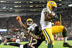 The Green Bay Packers' Adrian Amos intercepts a pass during the second half of an NFL game against the Chicago Bears Thursday, Sept. 5, 2019, in Chicago. The Packers won 10-3.