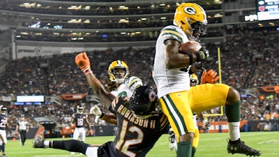 The Green Bay Packers' Adrian Amos intercepts a pass during the second half of an NFL game against the Chicago Bears Thursday, Sept. 5, 2019, in Chicago. The Packers won 10-3.