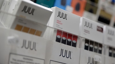 In this Dec. 20, 2018, file photo, Juul products are displayed at a smoke shop in New York.