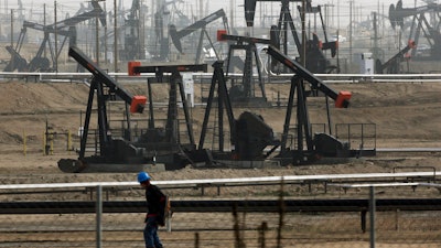 This Jan. 16, 2015, file photo shows pumpjacks operating at the Kern River Oil Field, in Bakersfield, Calif.
