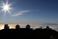 In this July 14, 2019, file photo, the sun sets behind telescopes at the summit of Mauna Kea.