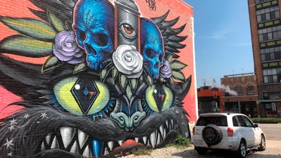 This Wednesday, Sept. 11, 2019 photo shows a mural painted Jeff Soto and Maxx Gramajo in Detroit.
