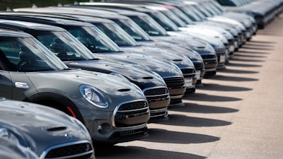 In this Aug. 25, 2019, file photo, unsold Clubman SUVs at a Mini dealership in Highlands Ranch, Colo.