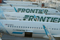 In this June 26, 2019, photo, Frontier Airlines jetliners sit at gates on the A concourse at Denver International Airport.