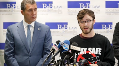 Adam Hergenreder, right, during a news conference Friday, Sept. 13, 2019, in Chicago.