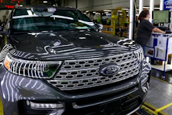 In this June 24, 2019, file photo, employees work on a Ford Explorer line at Ford's Chicago Assembly Plant.
