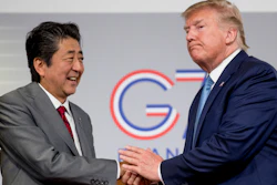 In this Aug. 25, 2019, file photo, President Donald Trump and Japanese Prime Minister Shinzo Abe shake hands following a news conference at the G-7 summit in Biarritz, France.