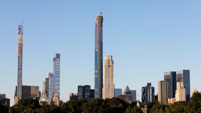 The Central Park Tower, center, under construction, Tuesday, Sept. 17, 2019 in New York.