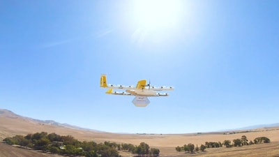 This undated image made from video provided in September 2019 by Wing, a member of the Alphabet family of companies, shows a delivery drone test which is part of a partnership with Walgreens.