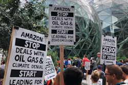 Amazon workers begin to gather in front of the Spheres, Friday, Sept. 20, 2019, in Seattle.
