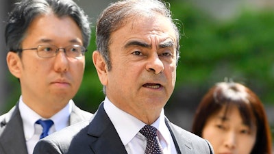 In this May 23, 2019, file photo, former Nissan chairman Carlos Ghosn arrives at Tokyo District Court.