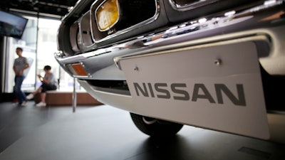 In this May 11, 2017, file photo, a Nissan car is displayed at its showroom in Tokyo.