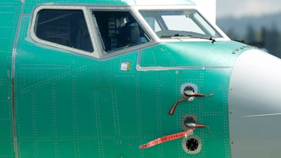 In this April 26, 2019, file photo, caution flags are shown on flight sensors on a Boeing 737 Max 8 airplane being built at Boeing's assembly facility in Renton, Wash.