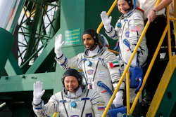 United Arab Emirates astronaut Hazza Al Mansouri, center, Russian cosmonaut Oleg Skripochka, bottom, and U.S. astronaut Jessica Meir, top, board the Soyuz MS-15 spacecraft for the launch at the Baikonur cosmodrome, Kazakhstan, Sept. 25, 2019.