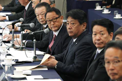 Akio Toyoda, center, president and CEO of Toyota Motor Corp., with a group of the Japanese automakers chiefs attend a meeting with Japanese Trade Minister Isshu Sugawara, not in picture, Sept. 26, 2019, in Tokyo.