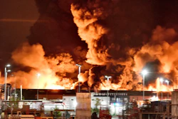 A fire is pictured at a chemical plant in Rouen, Normandy, Thursday, Sept.26, 2019. An immense mass of black smoke is rising over Normandy as firefighters battle a blaze at a chemical plant, and authorities closed schools in 11 surrounding towns and asked residents to stay indoors.