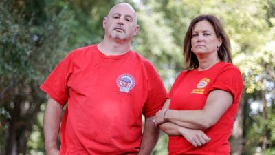 This Sept. 20, 2019, photo, shows General Motors workers Matt Himes and Tammy Hudak in Spring Hill, Tenn.
