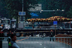 In this Saturday, Sept. 21, 2019, photo, a Chinese military vehicle possibly carrying a drone passes along the Jianguomenwai Avenue during a rehearsal for the 70th anniversary of Communist China, in Beijing. A parade on Tuesday, Oct. 1 by China’s secretive military will offer a rare look at its rapidly developing arsenal, including possibly a nuclear-armed missile that could reach the United States in 30 minutes, as Beijing gets closer to matching Washington and other powers in weapons technology.