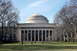In this April 3, 2017 file photo, students walk past the 'Great Dome' atop Building 10 on the Massachusetts Institute of Technology campus in Cambridge, Mass. MIT said Media Lab director Joi Ito resigned Saturday, Sept. 7, 2019, after reports he had a more extensive fundraising relationship with disgraced financier Jeffrey Epstein than previously acknowledged.
