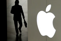 In this Jan. 3, 2019, file photo a man leaves an Apple store in Beijing. Apple on Tuesday, Sept. 10, is expected to unveil three new iPhone models that are so similar to last year’s lineup, they may be upstaged by details about the company’s upcoming video service.