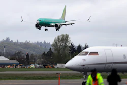 In this April 10, 2019, file photo a Boeing 737 MAX 8 airplane being built for India-based Jet Airways, top, lands following a test flight at Boeing Field in Seattle. Federal safety officials say Boeing should consider how cockpit confusion can slow the response of pilots who are dealing with the kind of problem that likely caused two airliners to crash in the past year.