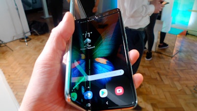 In this Tuesday April 16, 2019 file photo, the Samsung Galaxy Fold smartphone is presented during a media preview event in London. Samsung is hoping the innovation of smartphones with folding screens reinvigorates the market. Samsung says it will start selling its highly anticipated folding phone on Friday Sept. 6, 2019, after its original launch date was delayed by months because of embarrassing problems with the screen.