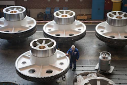 In this March 2, 2018 file photo, a worker cleans big machine parts of presses manufacturer Schüler AG in Goeppingen, Germany. German factory orders, a leading indicator of the health of Europe's biggest economy, dropped strongly in July, erasing gains from the previous month. The Federal Statistical Office reported Thursday industrial orders dropped 2.7% in July over June when adjusted for seasonal and calendar factors, wiping out a 2.7% June increase.
