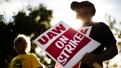 In this Sept. 16, 2019 file photo, union members picket outside a General Motors facility in Langhorne, Pa. The strike against GM by United Auto Workers entered its second week Monday, Sept. 23 with progress reported in negotiations but no clear end in sight. Bargainers met all weekend and returned to talks Monday morning as the strike entered its eighth day.