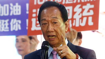 In this June 21, 2019, file photo, Terry Gou, chairman of Foxconn, the world's largest contract assembler of consumer electronics, speaks to the media after the company's annual shareholders meeting in New Taipei City, Taiwan. Gou has given up on making a bid for Taiwan's presidency. Gao announced his decision in a statement late Monday, Sept. 16, 2019, one day before a deadline to register for the race.
