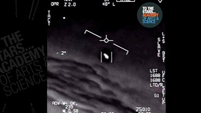 In this undated image made from video from a U.S. Navy aircraft and released by The Stars Academy of Arts & Science, an unidentified object moves near the plane in the air.