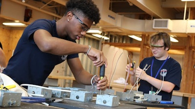 Students in the electrical program at H.C. Wilcox Technical High School in Meriden, Connecticut practice their skills.