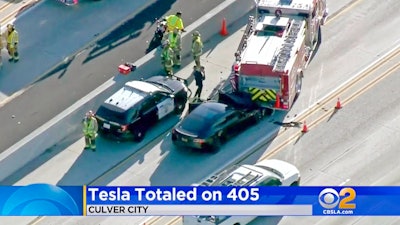 This Jan. 22, 2018, file still frame from video provided by KCBS-TV shows a Tesla Model S electric car that has crashed into a fire engine on Interstate 405 in Culver City, Calif. A government report says the driver of the Tesla that slammed into a firetruck was using the car’s Autopilot system when a vehicle in front of him suddenly changed lanes and he didn’t have time to react. The National Transportation Safety Board said Tuesday, Sept. 3, 2019, that the driver never saw the parked firetruck and didn’t brake.